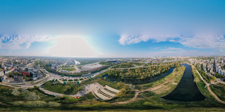 Beautiful sunset panoramic aerial drone view to panorama of Warsaw modern City with skyscraper and The PGE Narodowy National Stadium 360 © Raivo
