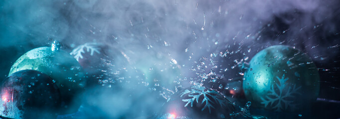 Water splash on dark foggy background. New year concept.