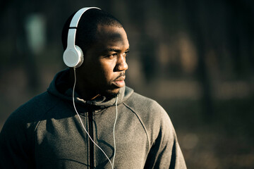 Focused young man during outdoor workout in woods