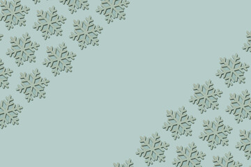 Festive border of wooden snowflakes on a blue background. Winter, Christmas, New Year concept.