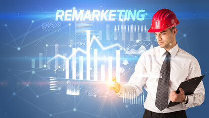 Young businessman with helmet drawing on virutal screen