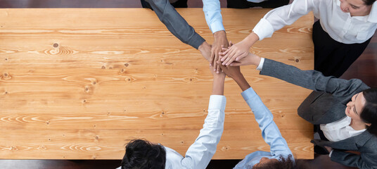 Top view panoramic banner hand stack by office worker show solidarity teamwork and trust in...