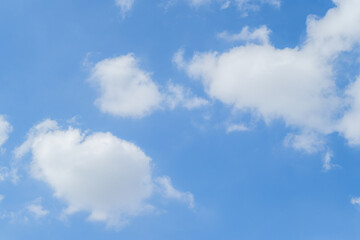 Vibrant colors dance in the sky as sunlight breaks through fluffy clouds.