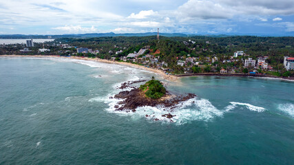 Beautiful Indian Ocean coastline on the island of Sri Lanka, Mirissa. Aerial photography.