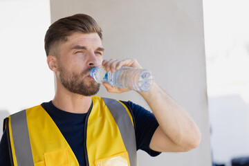 Healthy worker engineer team thirsty drinking clean water in hot temperature weather summer season...