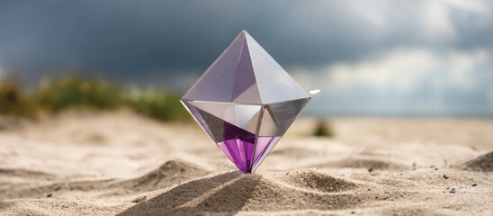 A purple crystal tetrahedron on sandy terrain under a clear sky.