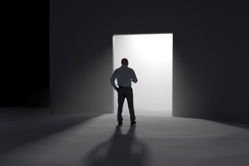 Obraz premium a man stands in front of the open doors towards the light