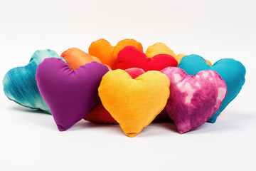 Small colorful fabric pillows shaped like a heart