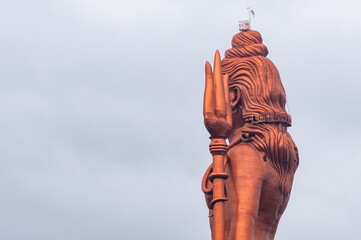 hindu god lord shiva isolated statue with bright background at morning from different perspective