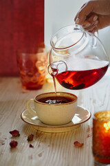 floral red tea in transparent teapot, no people, close-up