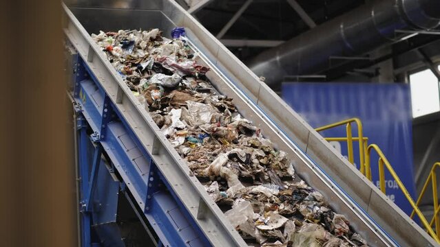 Garbage Recycling Factory, Plastic cubes for recycle Plant, Bales of pressed boxes, rubbish warehouse collection. Preparation of recyclables for recycling, Plastic city garbage.