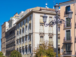 Old historic buildings surrounding the Plaza de Isabel II in downtown Madrid near the Madrid Opera house.