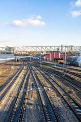 Fototapeta na wymiar above view empty railroad tracks at railway siding on sunny autumn day