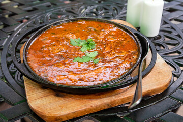 travel to Georgia - Georgian dish Ostri (stewed pieces of meat in sauce with Georgian spices) in...