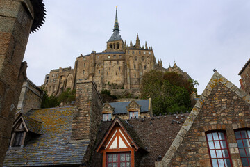 A view of the Mont Saint Michel cathedral over the roof tops