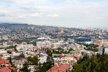 Fototapeta na wymiar travel to Georgia - above view of Tbilisi city from observation deck of Mtatsminda Pantheon on autumn day