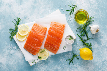 Salmon. Fresh raw salmon fish fillet with cooking ingredients, herbs and lemon, top view