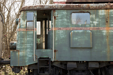 A rusty old green locomotive
