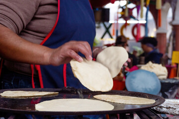  the traditional preparation of corn tortillas, where expert hands carry out the ancestral process...