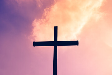 Black cross on a background of red and purple flaming sky, from heaven to earth fall fireballs, the...