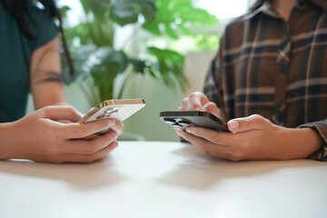 friends using smartphone mobile addict spending time checking social media cell telephone technology Friendship social addiction