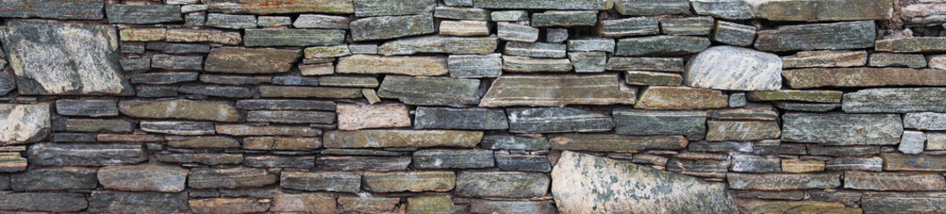 Stone texture close-up, rugged surface with natural imperfections, symbolizing durability, strength, timelessness. Ideal for architectural, nature, or background concepts
