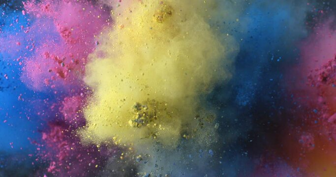 Super slow motion close up of flying rainbow colors powder particles explosion isolated on black background at 1000 fps.