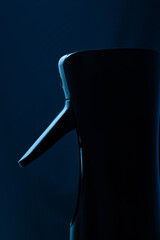 Close up of a spray gun on blue background. Spraying water. Hairdressing spray gun