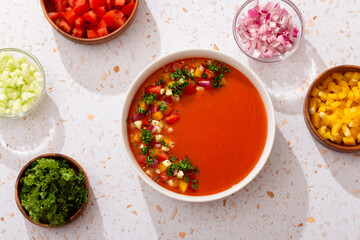Spanish tomato gazpacho cold soup styled and decorated in white plate