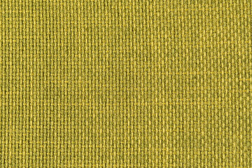 A green woven fabric texture. The image is a full frame of the fabric with a slight variation in...