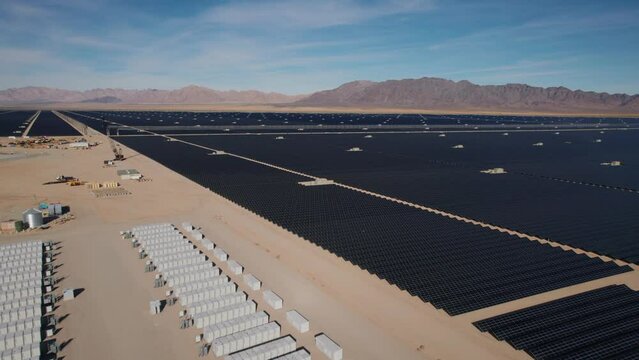 White battery power storage array battery units at a large solar power plant in the desert