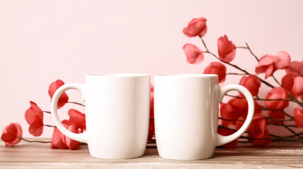 Fototapeta na wymiar Valentine's Day Bliss: Bouquet of Red Roses and Two White Cups