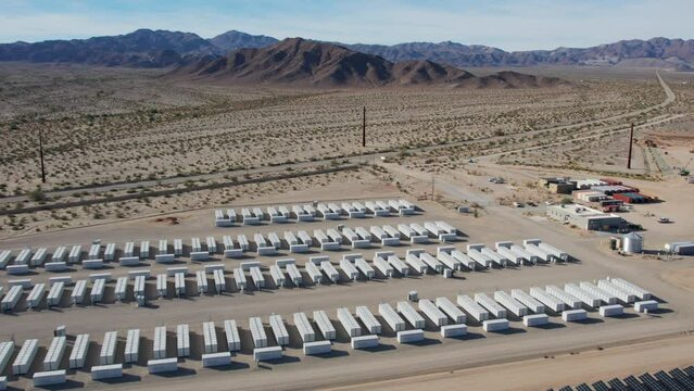 White battery power storage array battery units at a large solar power plant in the desert
