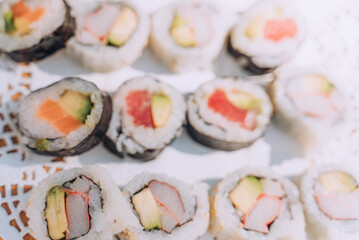 Closeup of Assorted Sushi at a Picnic Outdoors