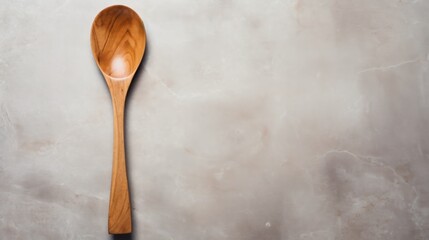  a wooden spoon sitting on top of a white counter top next to a gray and black counter top with a wooden spoon resting on top of the counter top of the spoon.