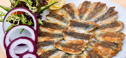 Delicious and beautiful fried hamsi fish and salads