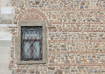 Fototapeta na wymiar WINDOW ON THE BRICK WALL