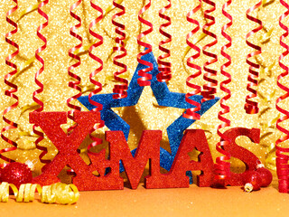 Gold color Christmas and Happy New Year 2024 holiday background with red Xmas label and blue star shape