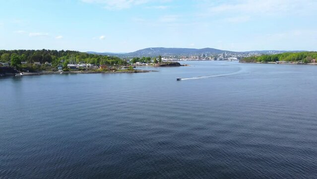 Intercepting Speedboat Leaving Trail of Foamy Waves, Action Shot - Oslo, Norway 2.7K Aerial Footage