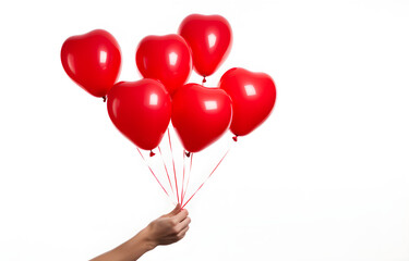 bunch of red heart shape balloons in man's hand on white background