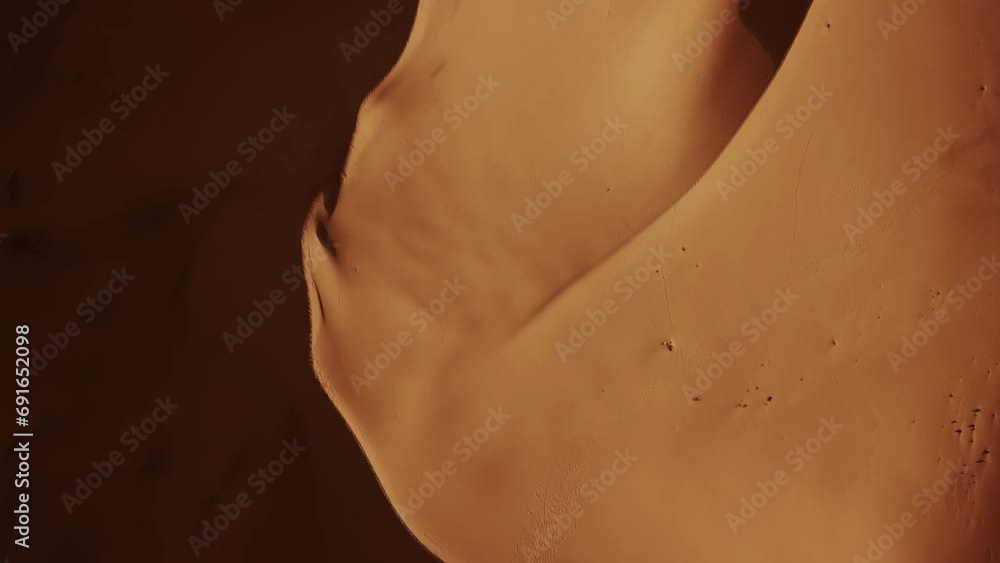 Wall mural aerial top view on sand dunes in sahara desert, africa, 4k
