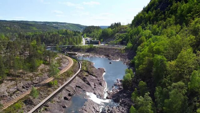 Dynamic Shot Lumber Slide, Steinsfoss Power Station, River Otra and Bridge - Grovane, Norway 2.7K Aerial Footage