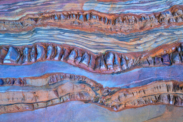 Colorful sedimentary rock layers in natural patterns