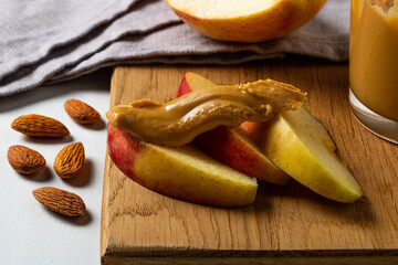 Apple slices with peanut butter. A healthy and tasty snack.