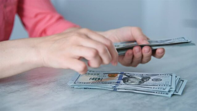 Woman Hands Counting 100 Dollar Banknotes In Office. Profit And Finance Concept. Close Up