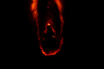 burning paper, glowing edge of paper on a black background