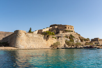 Fototapeta premium Crossing Elounda bay looking towards the historic island of Spinalonga. Crete, Greece.