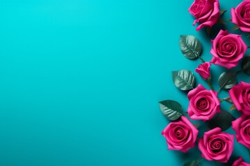 Magenta Roses Flower Border Over a Turquoise Background With Copy Space. Copy space.