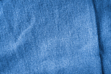 Texture of blue jeans textile close up