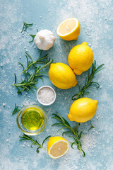 Lemon, rosemary, garlic, salt and olive oil. Ingredients for mediterranean cuisine cooking. Top view